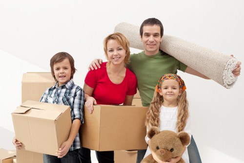 Professional team handling bulky furniture during a Balham flat move