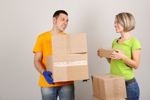Furniture and boxes being moved through a Balham apartment building