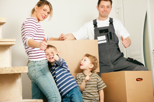 Professional removals team handling furniture during a Balham home move